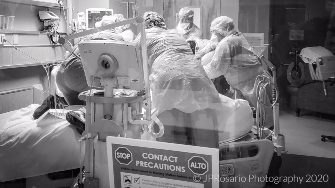 JFK Medical Center ICU nurse JP Rosario captures the moment a team rushes to help a patient on a ventilator.