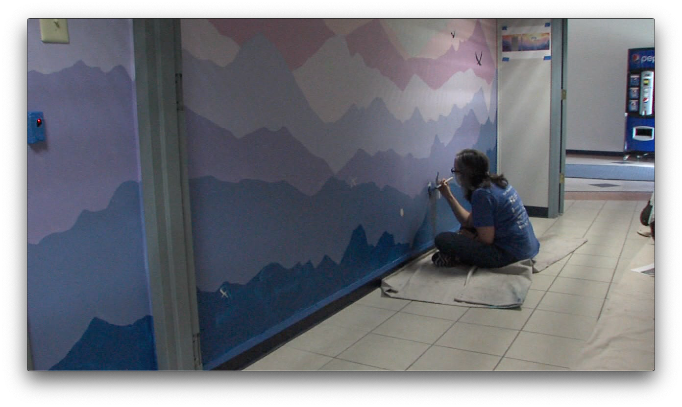 The mural inside the Johnson County Prosecutors Office in vibrant. 