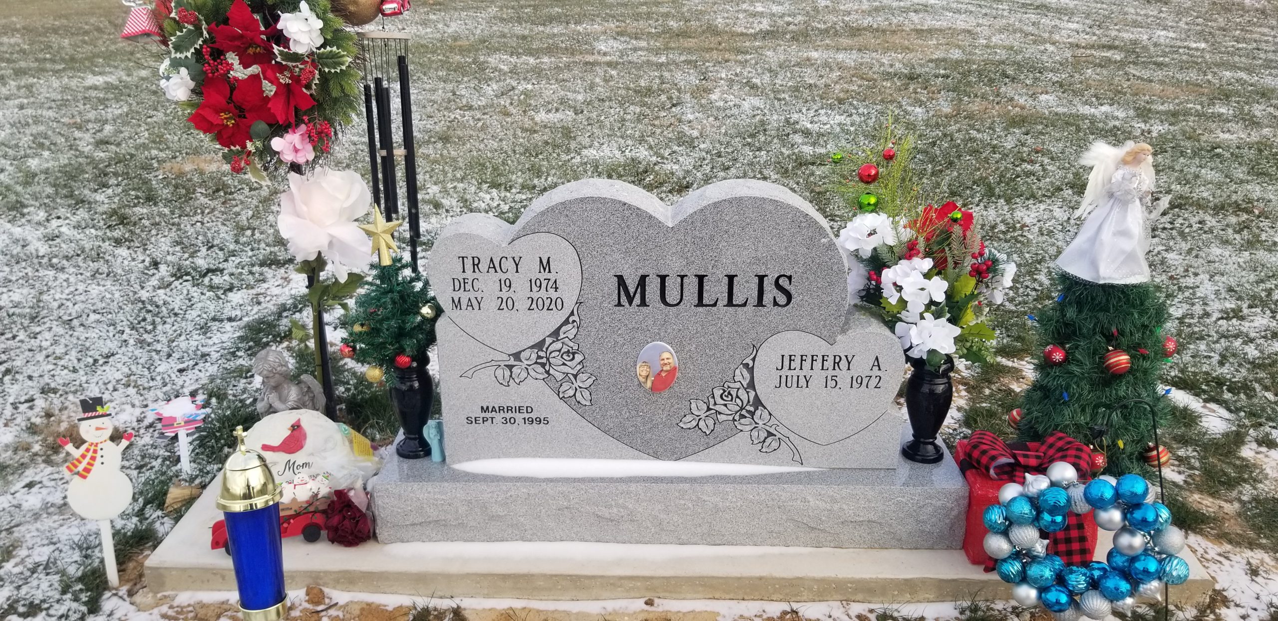 Jeffery Mullis shared a photo of the gravestone where his wife is now buried, "We took this on Christmas Day because it had snowed and she always wanted snow on Christmas." He says he wanted to share this photo so other families can see the effects COVID-19 can have on a family.