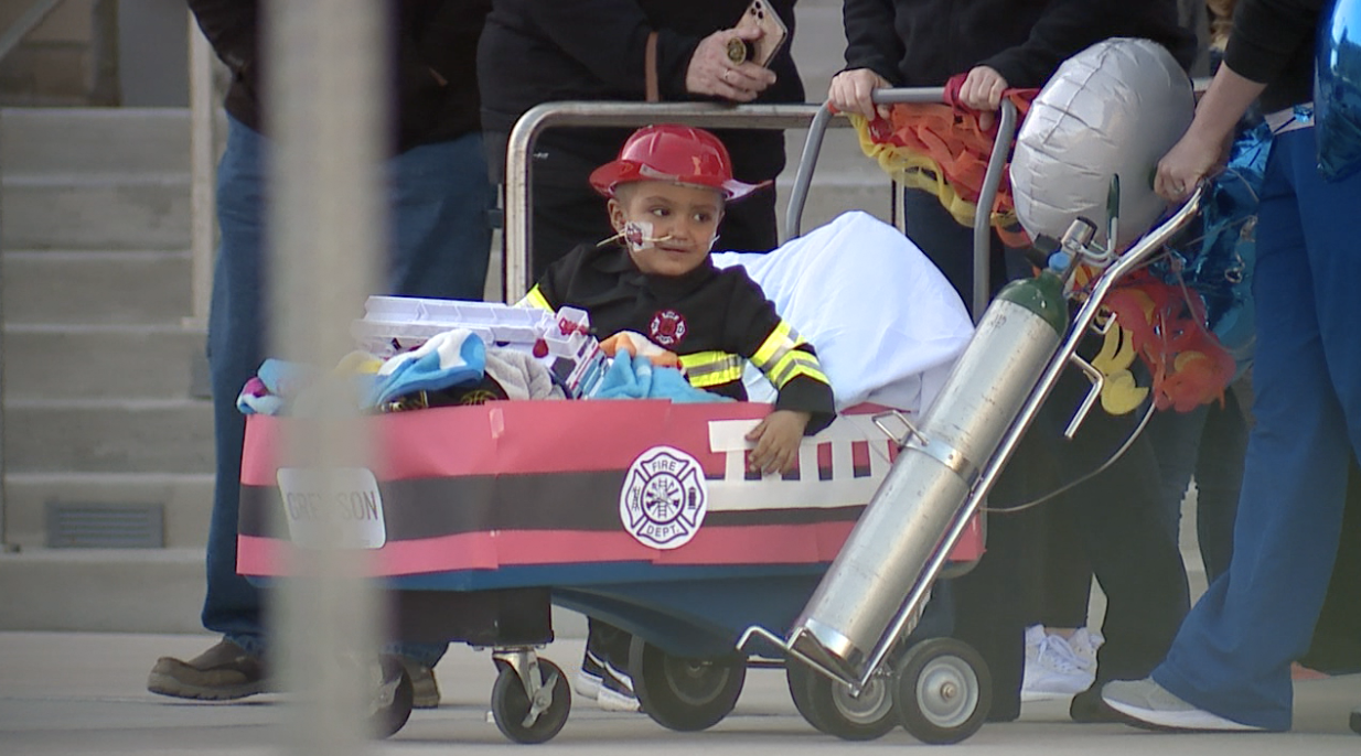 Greyson in his fire wagon