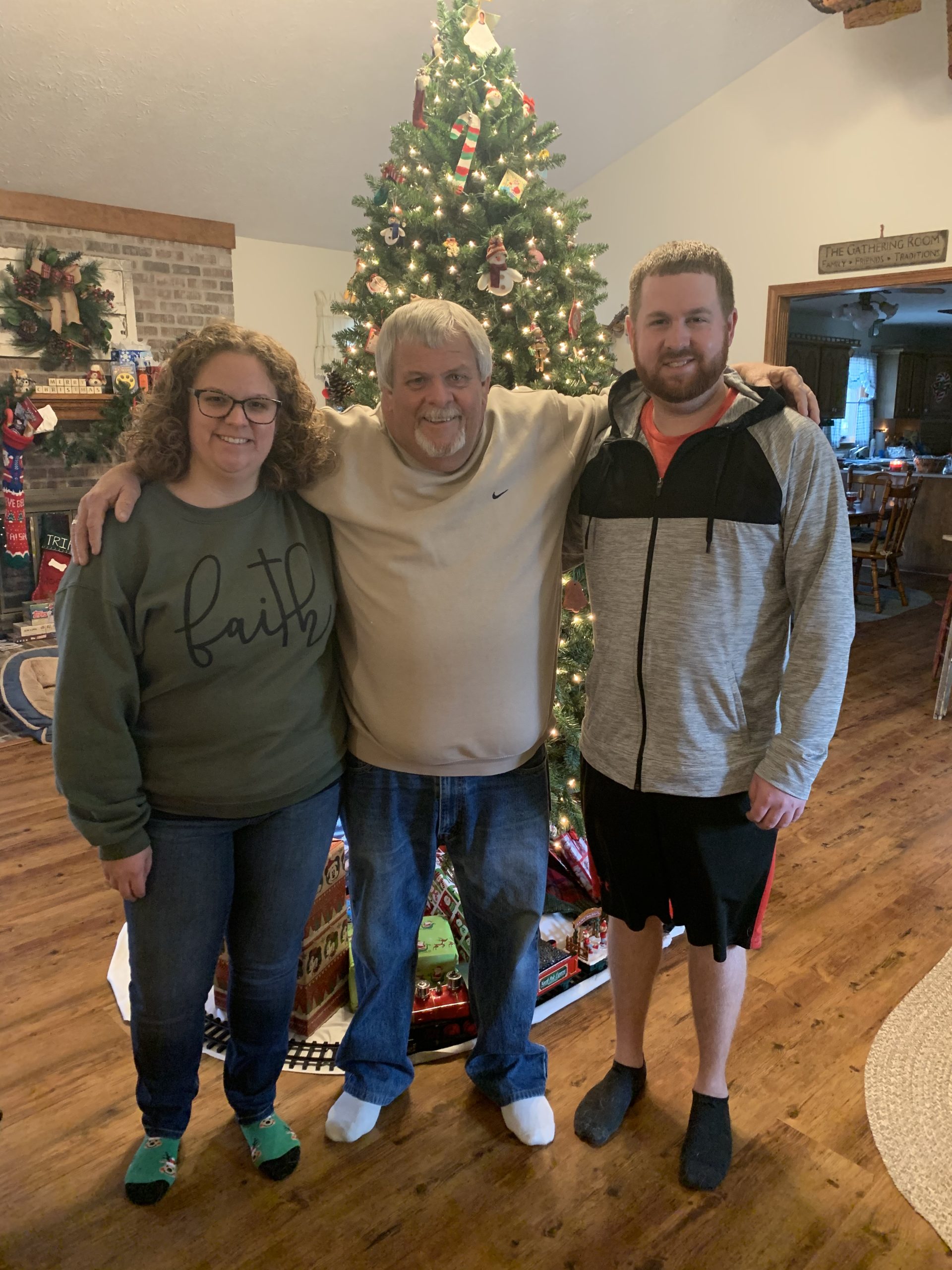 Matt, his sister and dad around Christmas.
CREDIT: Alexander Family