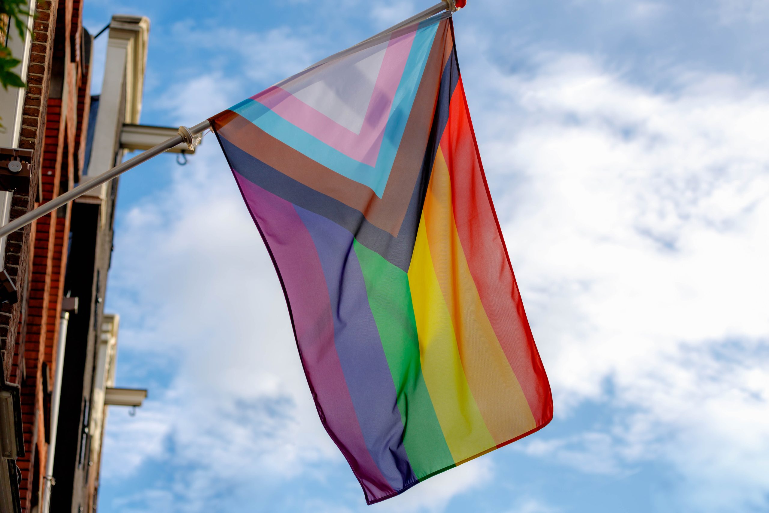 Progress,Pride,Flag,(new,Design,Of,Rainbow,Flag),Waving,In