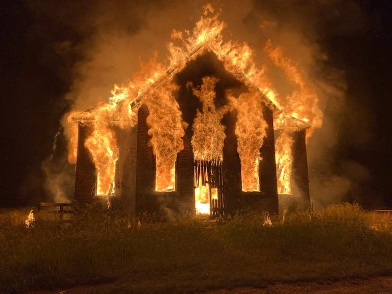Old schoolhouse on fire