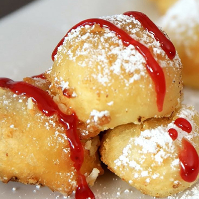 deep-fried-cheesecake-bites_ap-concessions-cropped_51297959481_o.jpg