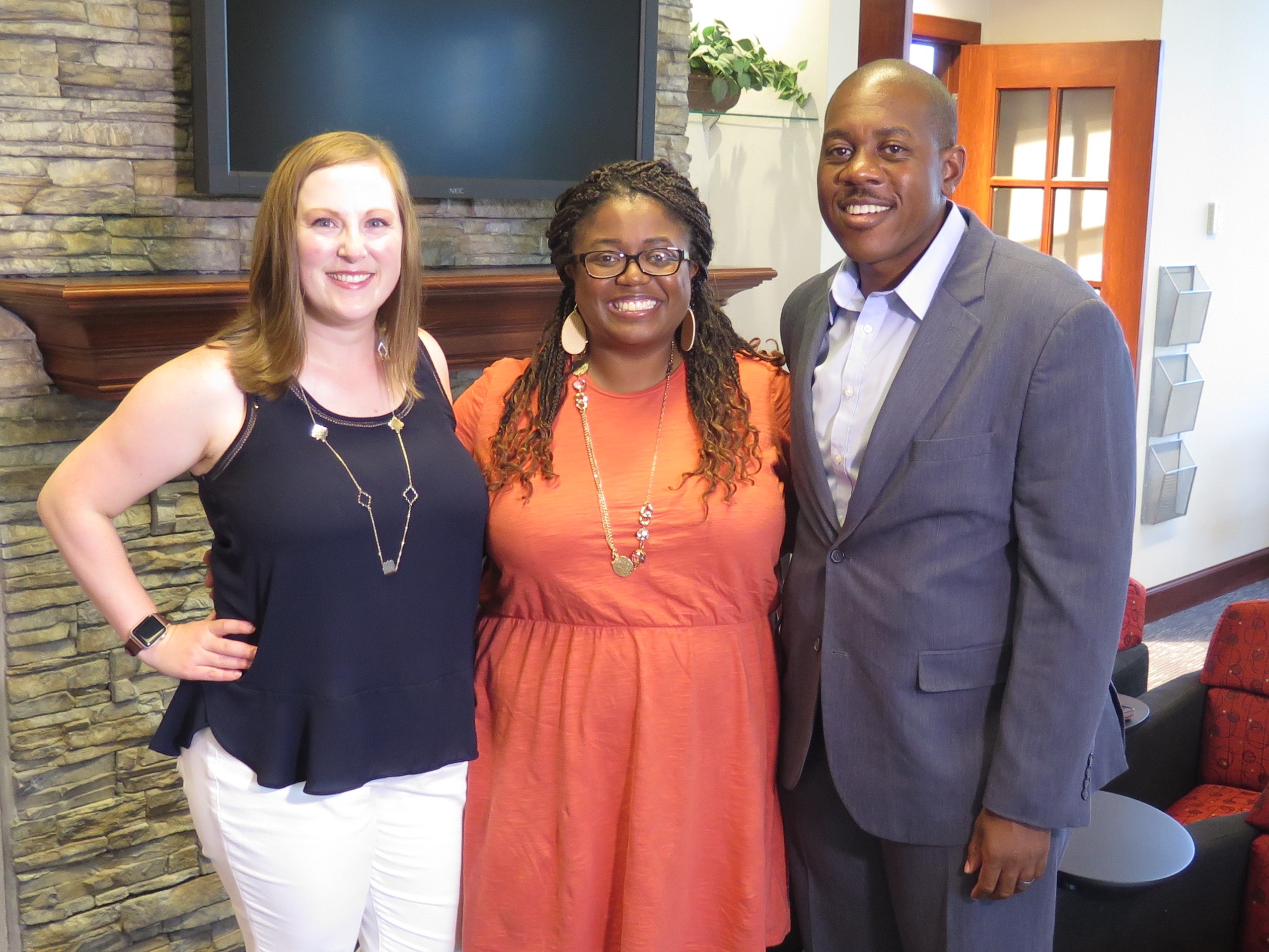 Realtor Amy Goodman, left, with Erica and Aaron Parker at the Sibcy Cline office in West Chester. Goodman has red, shoulder-length hair and is wearing a navy top and white slacks. Erica Parker's long hair is braided. She's wearing glasses and a coral-colored dress. Aaron Parker has short-cropped hair and a mustache and is wearing a blue suit.
