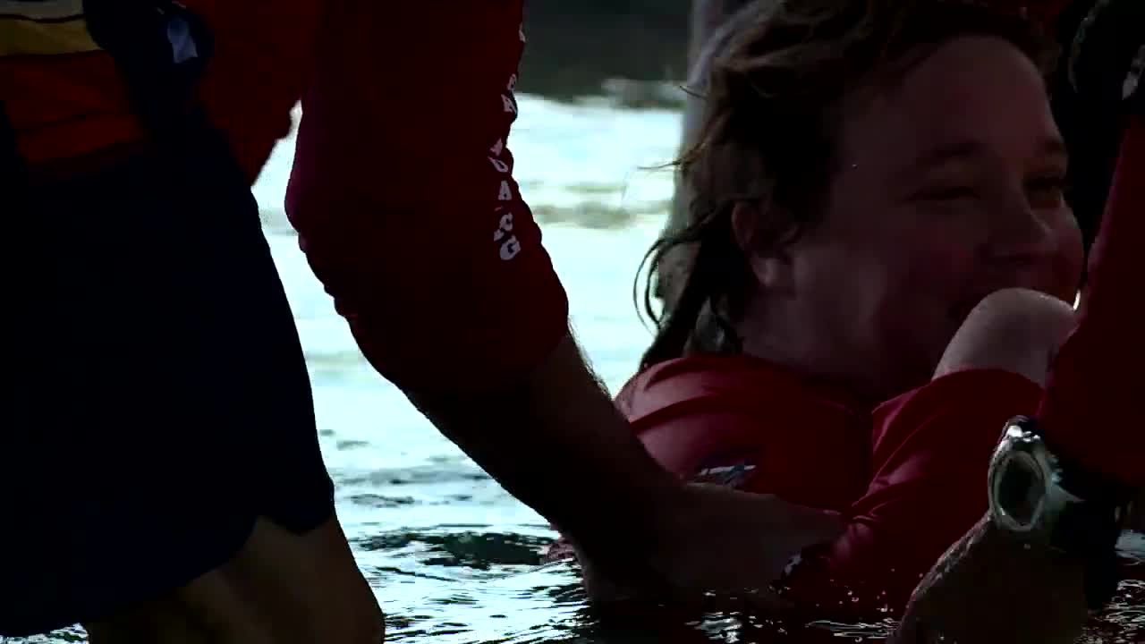Christina Ford helped out of water after scuba diving