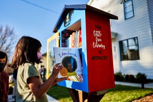 4-Kaya Shah pulling a book Burlingame.jpg