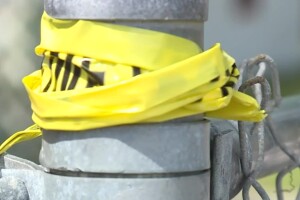 Crime scene tape in the area of Fourth Street and Douglass Avenue in West Palm Beach after a deadly shooting on April 7, 2022.jpg