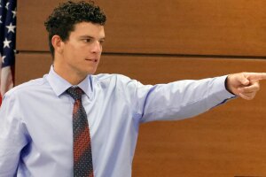 Former Marjory Stoneman Douglas student Christopher McKenna points out the defendant during the Marjory Stoneman Douglas High School shooter Nikolas Cruz penalty phase of his trial at the Broward County Courthouse in Fort Lauderdale on Wednesday, July 19, 2022. McKenna was the first student to encounter Cruz before his rampage.