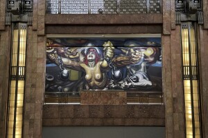 “The new democracy” mural by Mexican artist David Alfaro Siqueiros is displayed in the Palacio Bellas Artes, in Mexico City, Tuesday, Aug. 2, 2022. The 88-year-old palatial art nouveau performing arts center's interior walls are graced with famous murals by Siqueiros, Diego Rivera and Jose Clemente Orozco. (AP Photo/Fernando Llano)