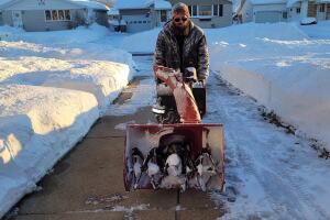 Janalee Spink sent this photo of her husband helping out the neighborhood.