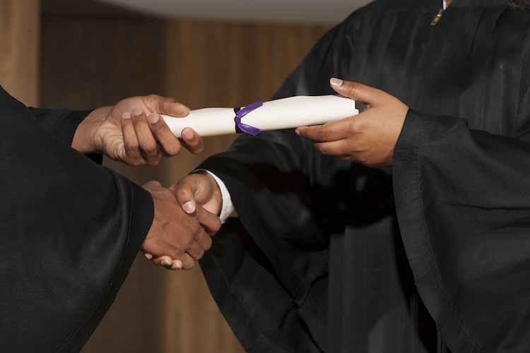Diploma in hands at graduation ceremony