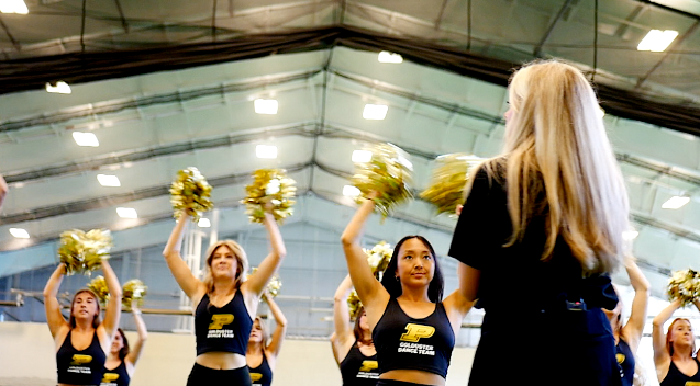 Coach Natalie Hess and the Purdue Goldusters 