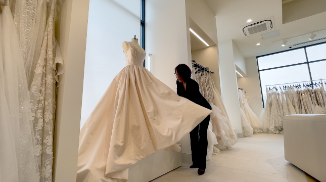 Young Colling prepares a dress for the floor 