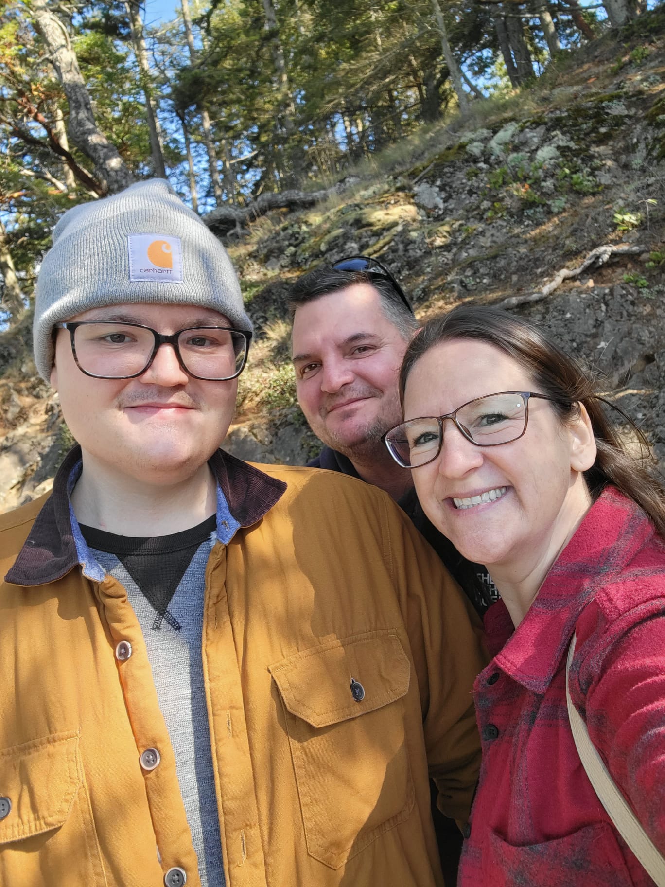 riley with parents.jpeg