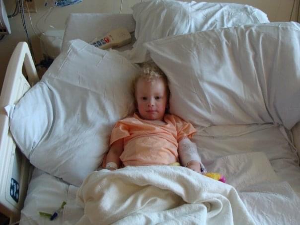 Aly Edmondson in a hospital bed. 