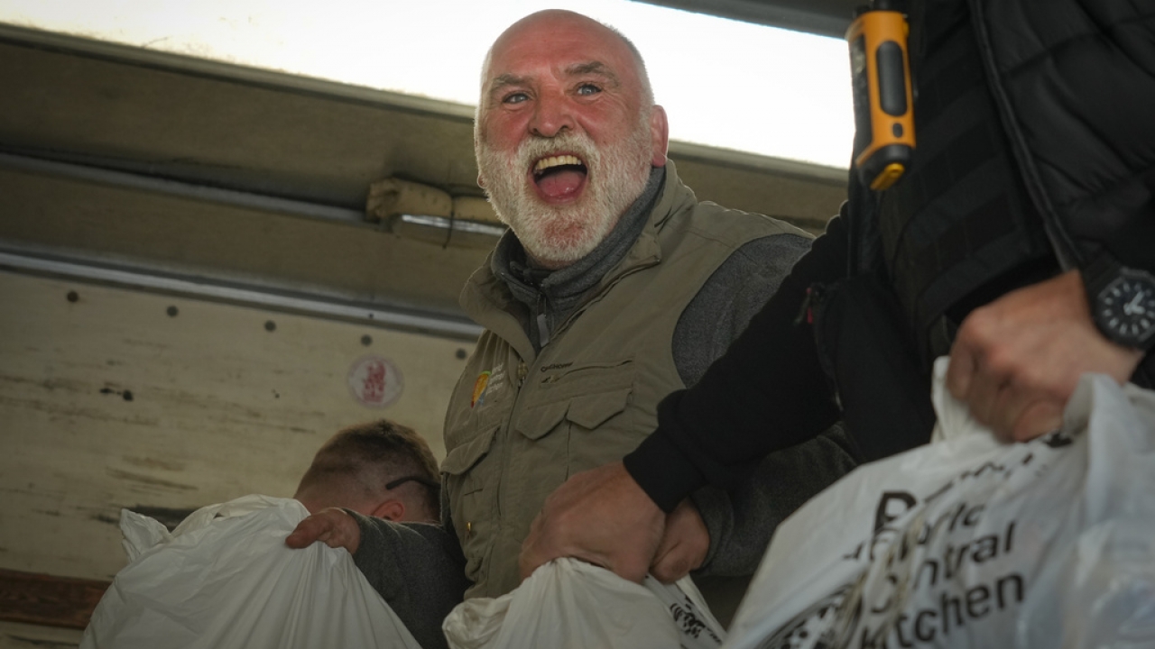 Jose Andres, a Spanish chef and founder of World Central Kitchen, unloads humanitarian food packages.