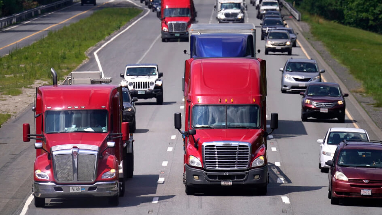 Trucks and cars on Interstate 495.