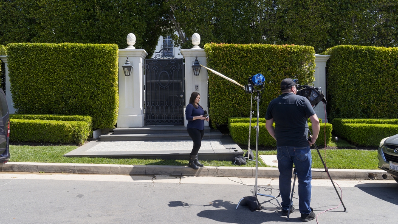 Television crews report live outside a property belonging to Sean "Diddy" Combs.