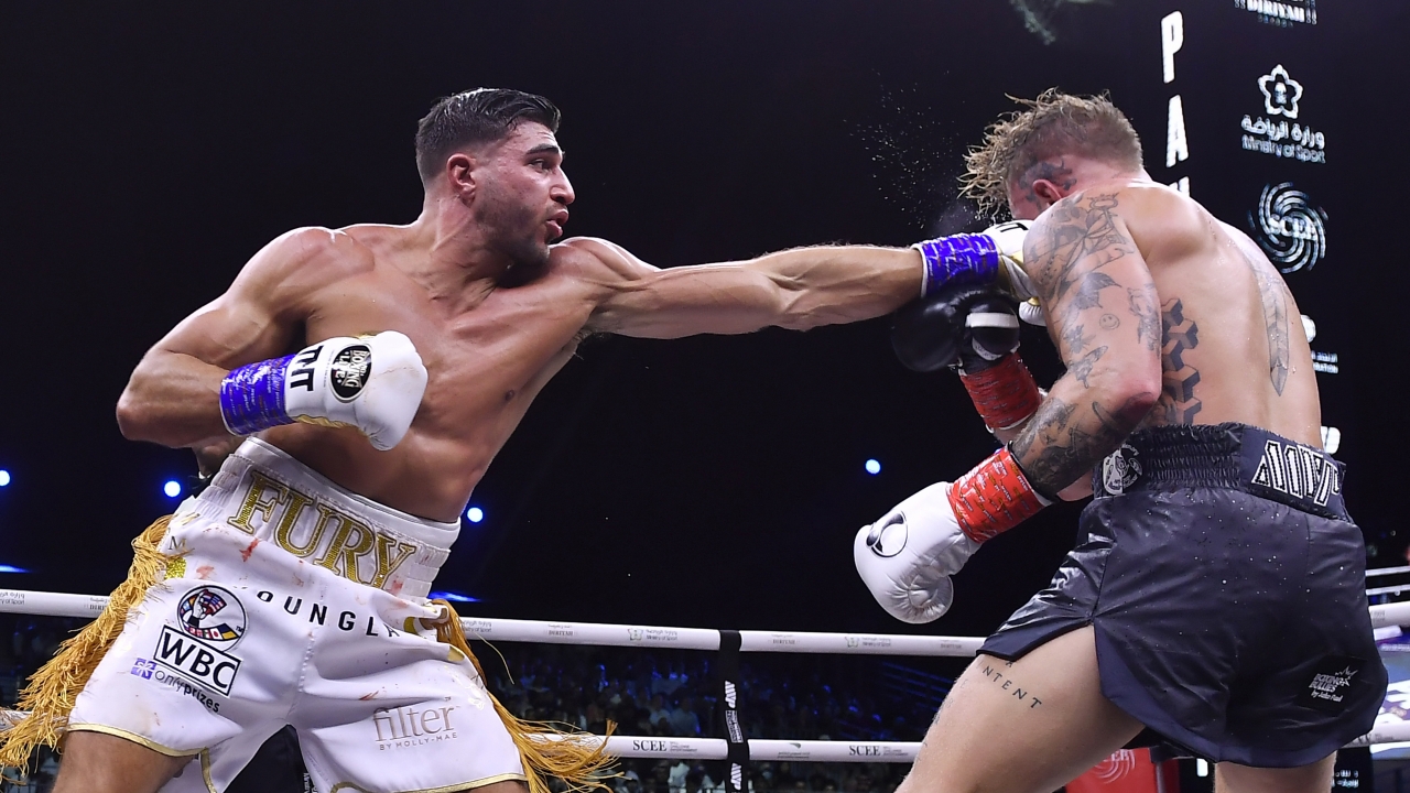 Jake Paul, right, and Tommy Fury, in action during their boxing match.