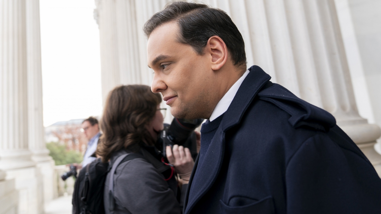 Rep. George Santos leaves the Capitol after being expelled from the House of Representatives.