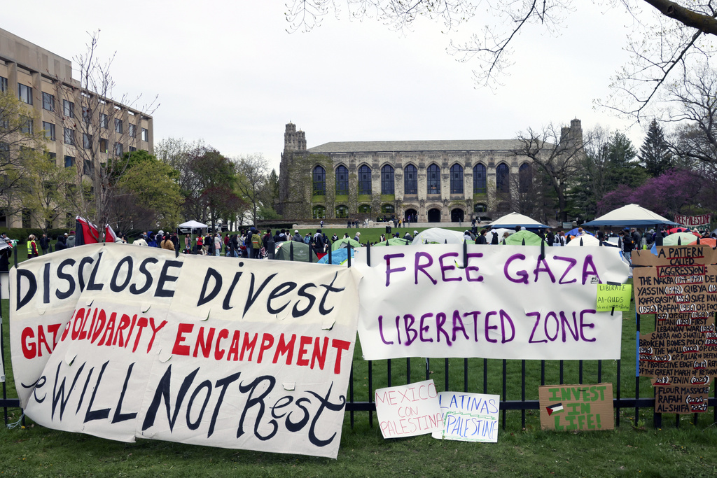 Signs are displayed outside a tent encampment at Northwestern University