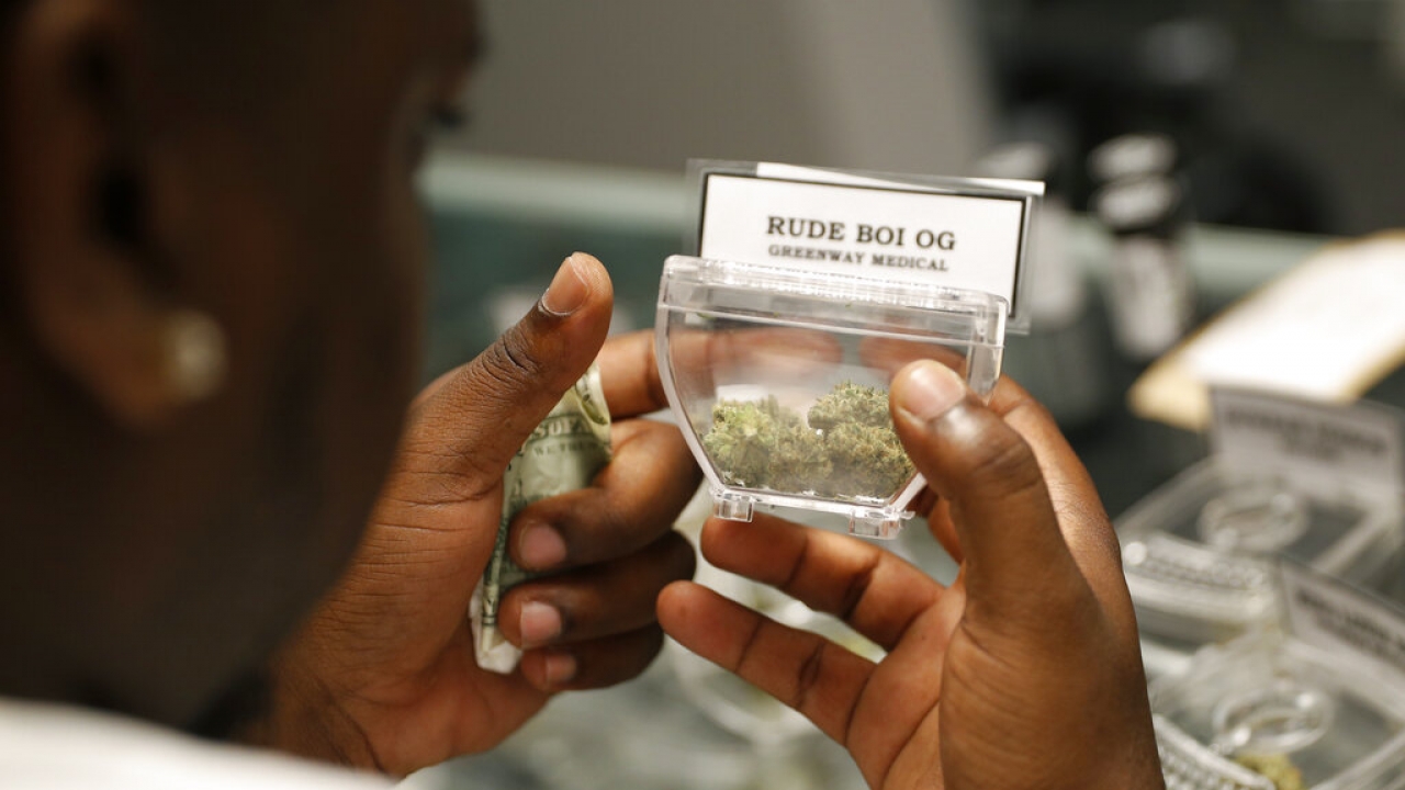 Customer shops for marijuana at a dispensary.