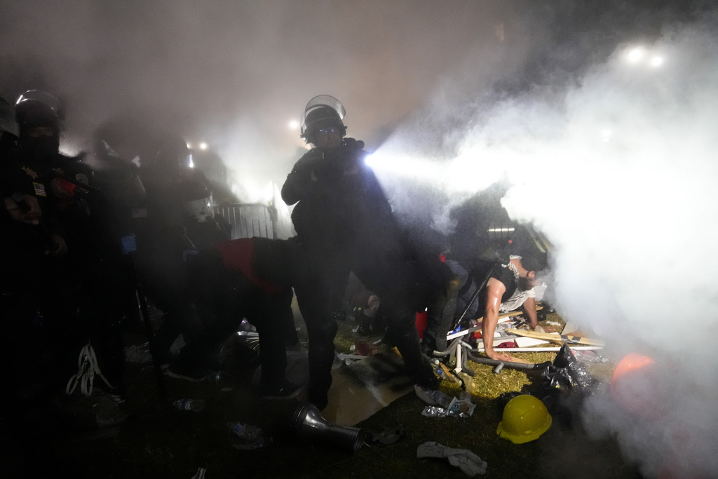 Police dismantle an encampment set up by pro-Palestinian demonstrators at UCLA.