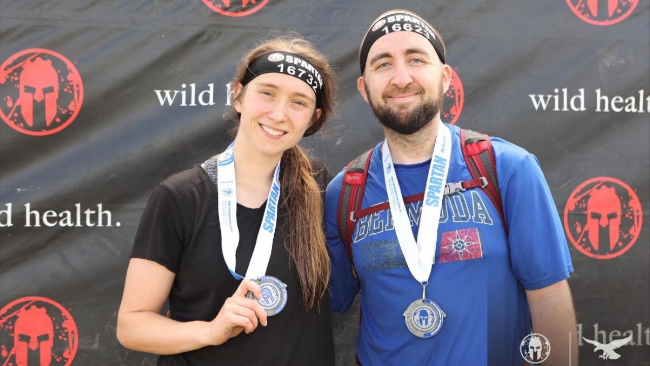 Lauren and Christopher Skerritt are pictured with medals.