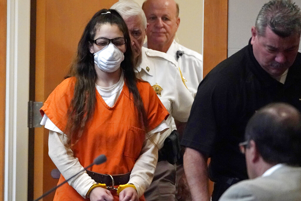 Kayla Montgomery is led into court for proceedings.