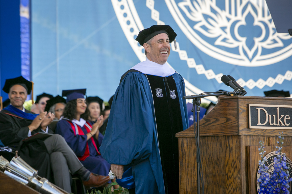 Duke University commencement speaker Jerry Seinfeld laughs on stage during the school's graduation ceremony.