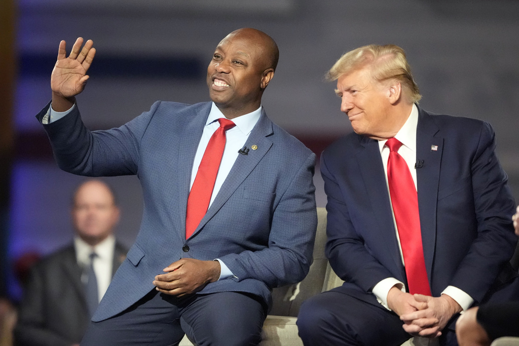 Republican presidential candidate former President Donald Trump with Sen. Tim Scott.