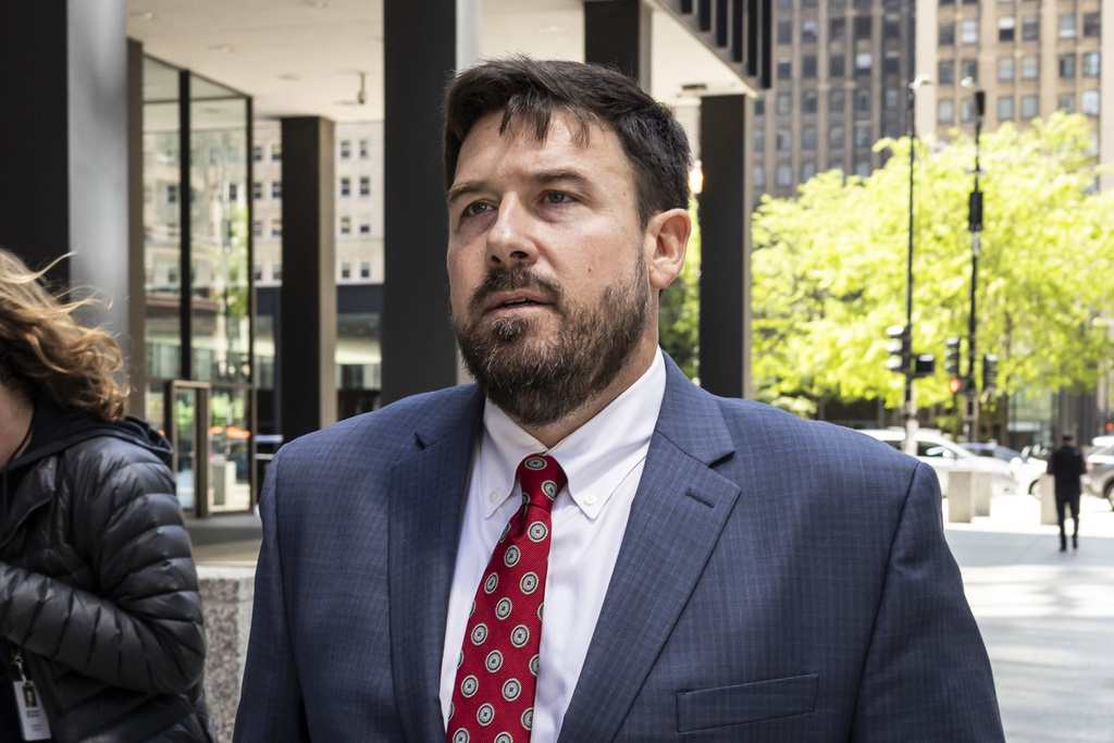 Richard Globensky, of Georgia, walks out of the Dirksen Federal Courthouse after pleading guilty to transporting stolen golf merchandise and memorabilia from the Augusta National Golf Club.