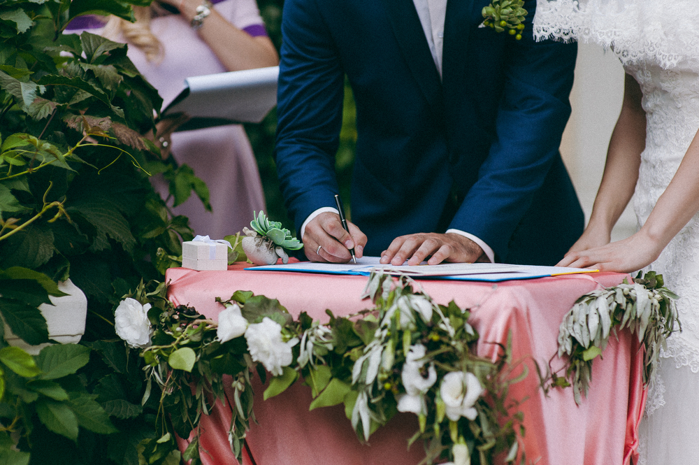 A couple during their wedding's signature ceremony.