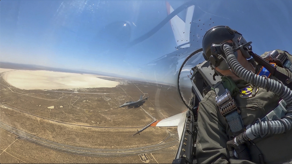 This image from remote video released by the U.S. Air Force shows Air Force Secretary Frank Kendall aboard an autonomous warplane.