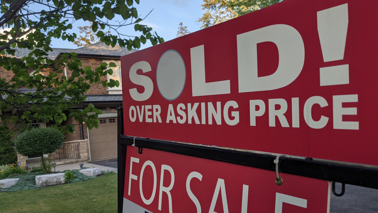 For sale sign in front of a home