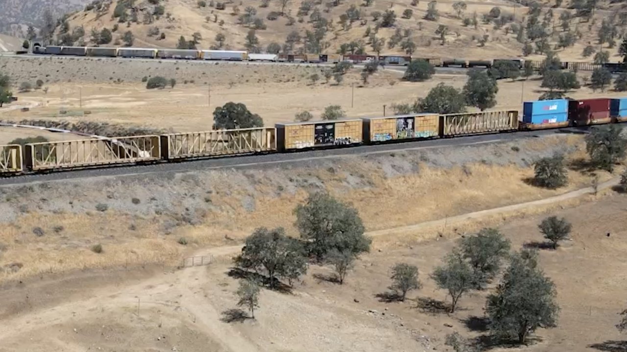Smoke above derailed trains cars.