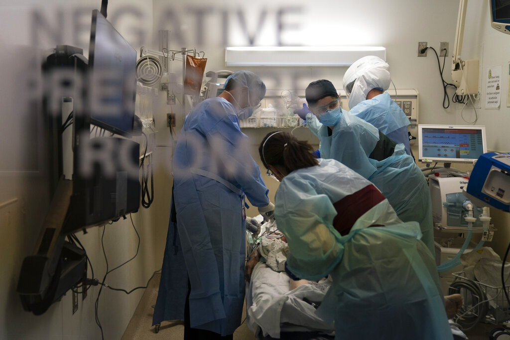 Person performing chest compression on a patient.