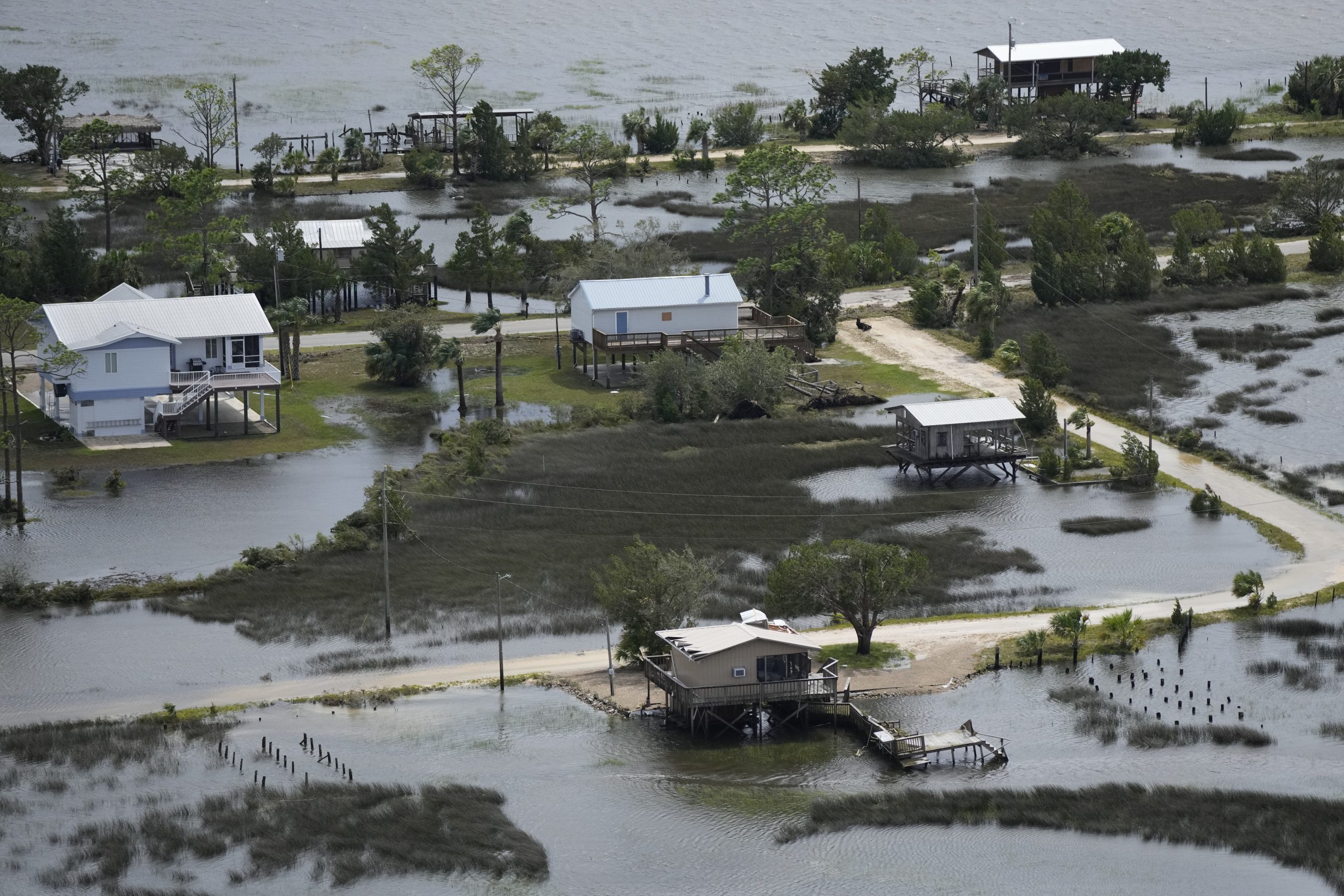 Receding storm waters surround homes in Keaton Beach, Fla., following the passage of Hurricane Idalia