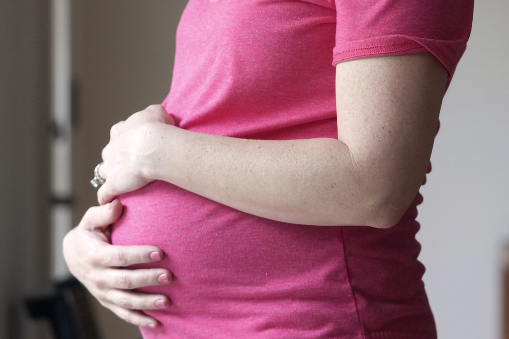 A pregnant woman.