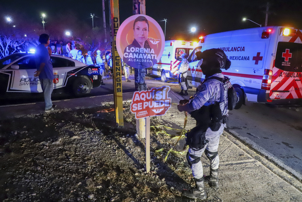 Mexican security forces cordon off the area after a stage collapsed due to a gust of wind.