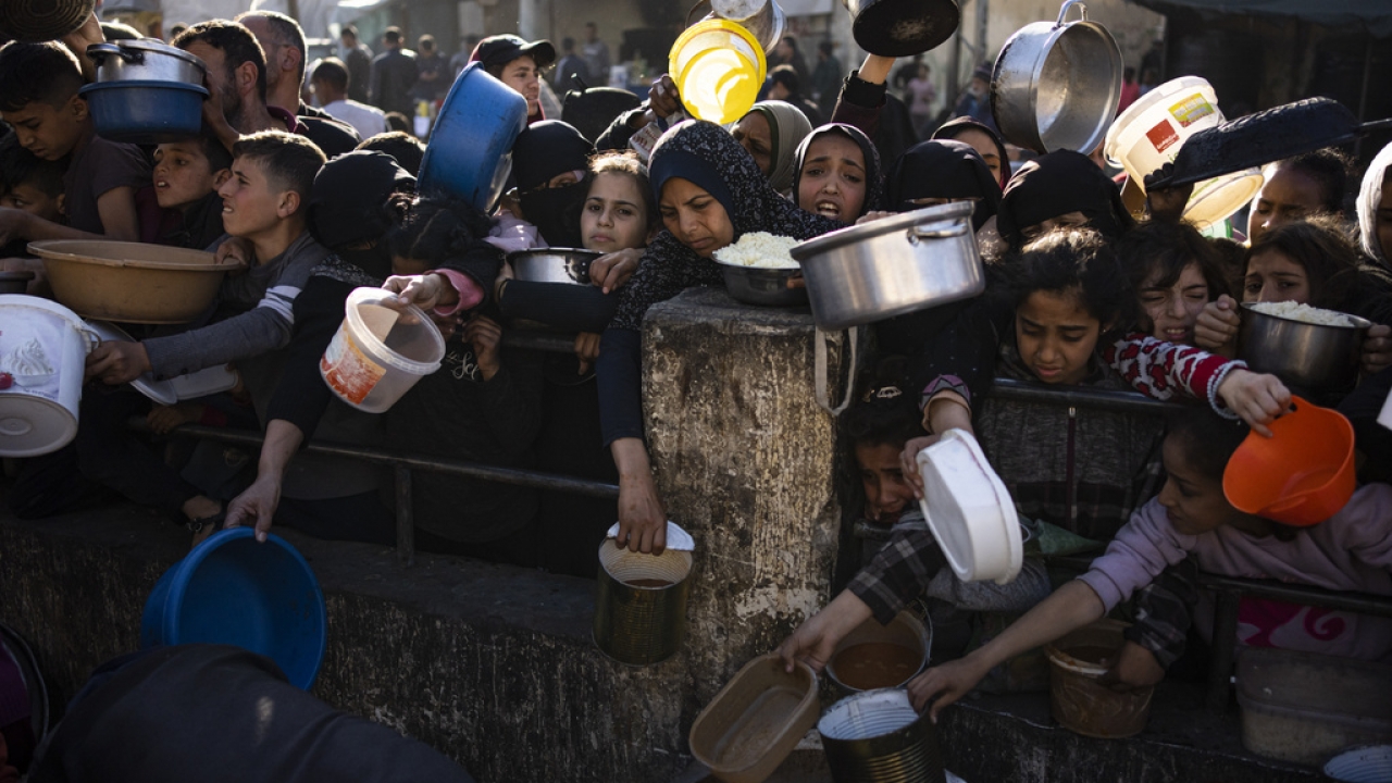 Palestinians line up for food in Rafah, Gaza Strip.