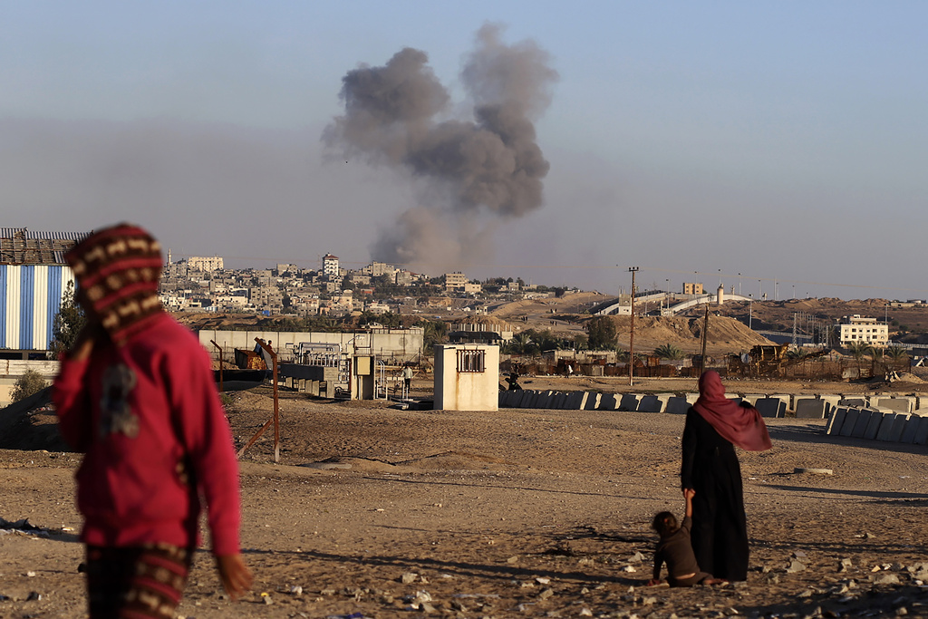 Smoke rises following an Israeli airstrike on buildings near the separating wall between Egypt and Rafah