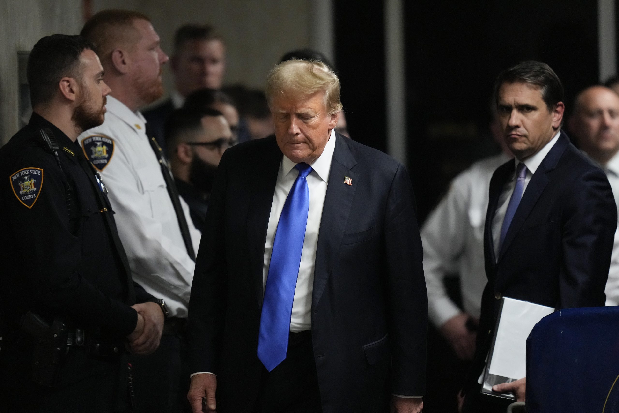 Former President Donald Trump walks to make comments to members of the media after a jury convicted him of felony crimes for falsifying business records in a scheme to illegally influence the 2016 election.