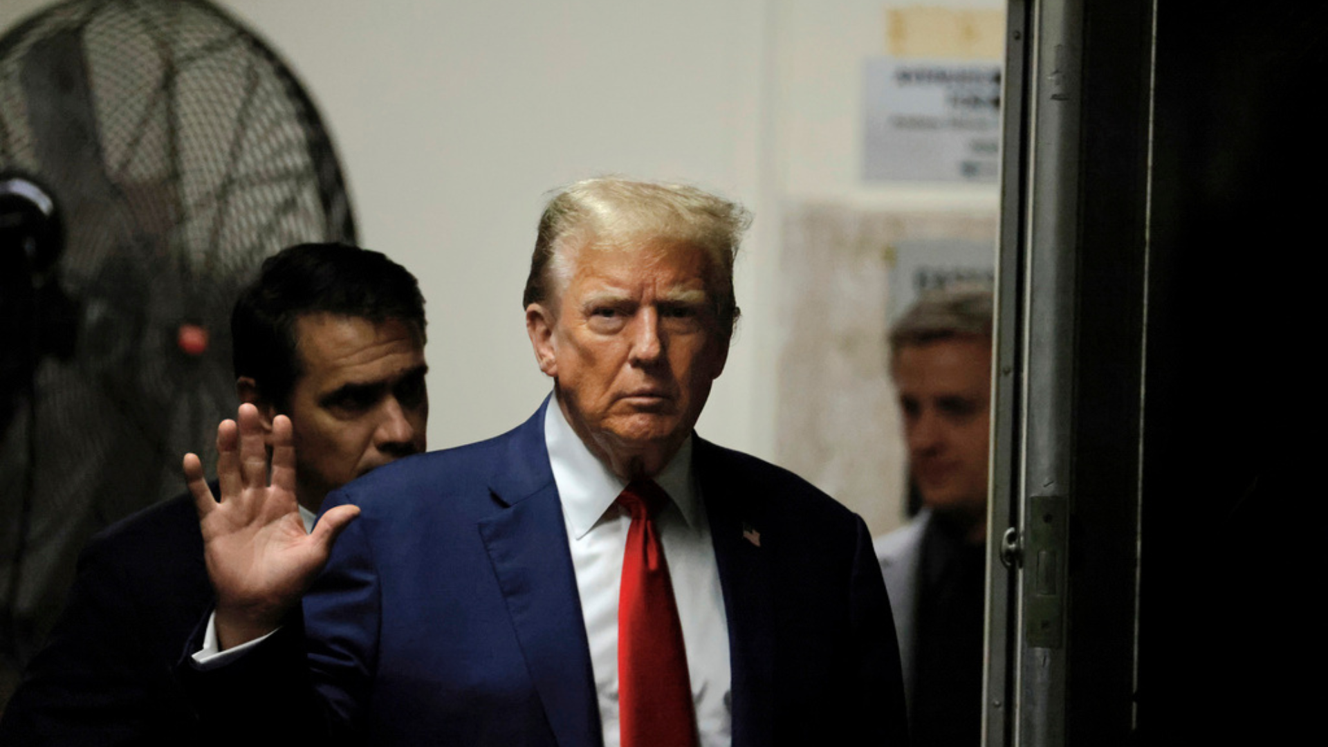 Former President Donald Trump returns from a break in his criminal trial