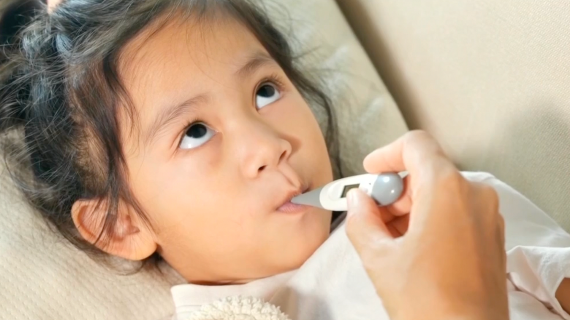 A child with a thermometer