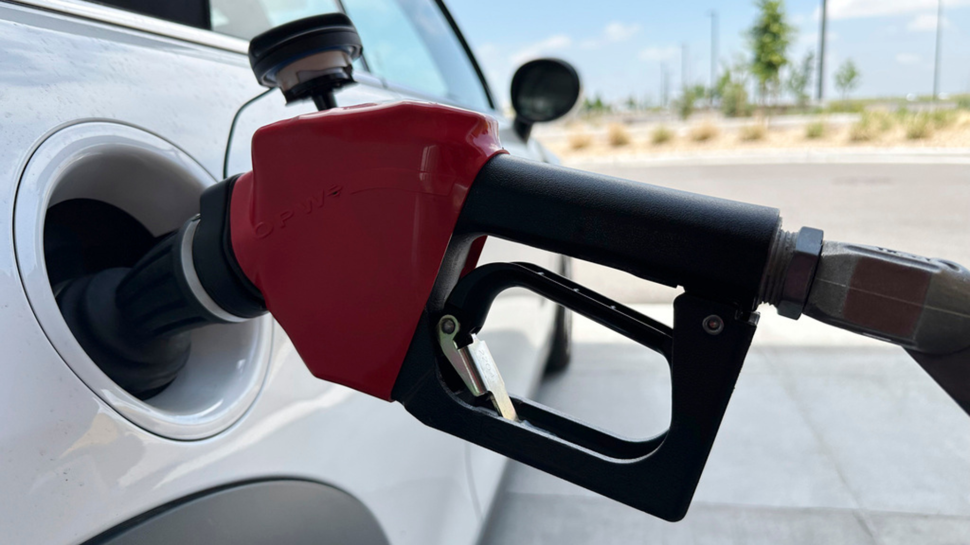 A motorist fills up the tank of a vehicle at a gasoline pump at a Costco warehouse.