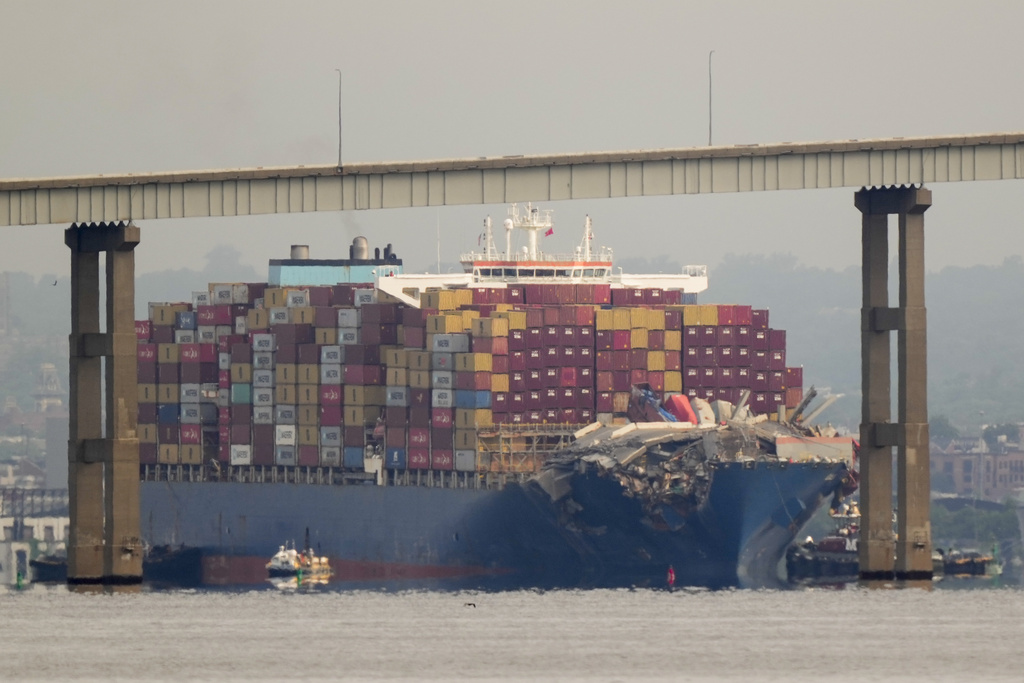 Tugboats escort the cargo ship Dali after it was refloated in Baltimore