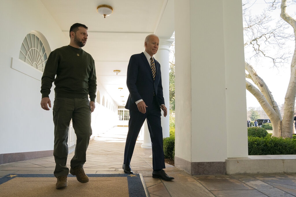 President Joe Biden and Ukrainian President Volodymyr Zelenskyy walk along the Colonnade of the White House in Washington