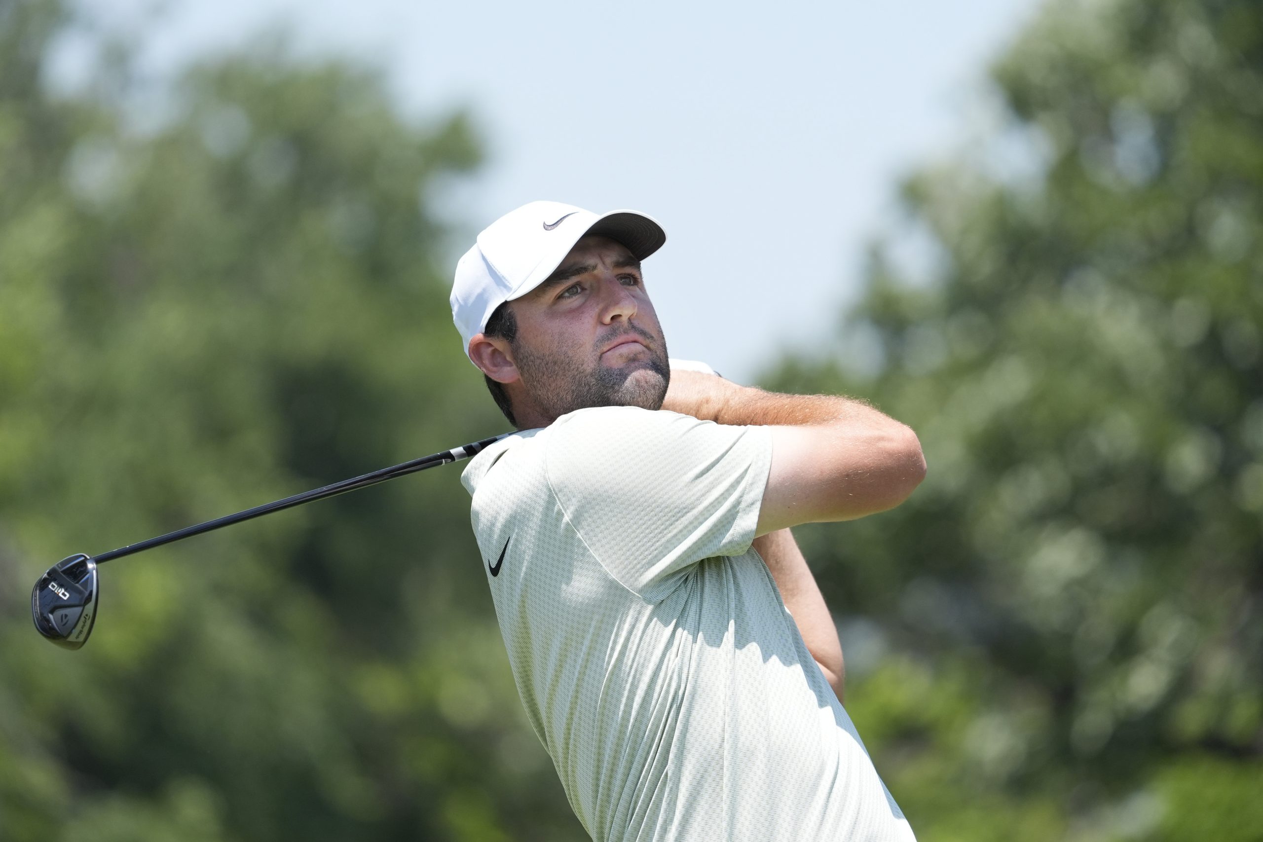 Scottie Scheffler hits a tee shot on the third hole during the final round of the Charles Schwab Challenge golf tournament.